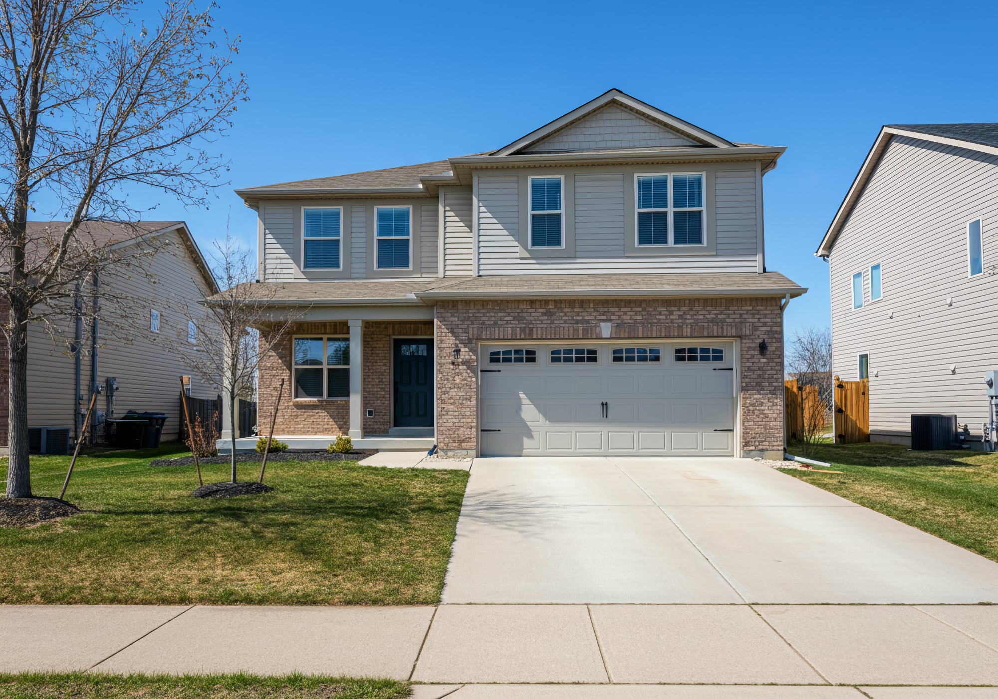 A 2000's two story home with an attached garage in Canton, Michigan