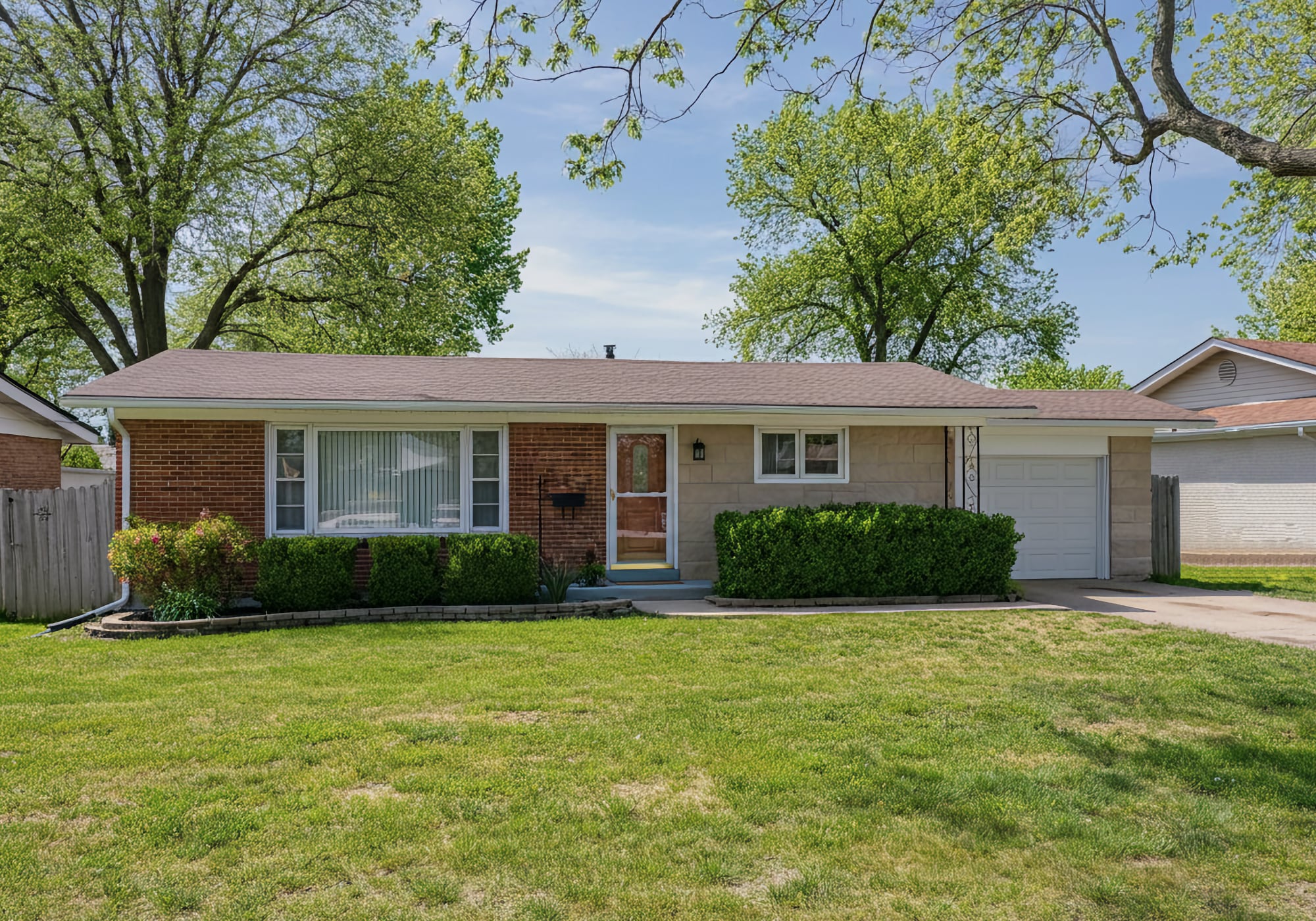 A 1950's brick ranch home with attached garage in Livonia Michigan