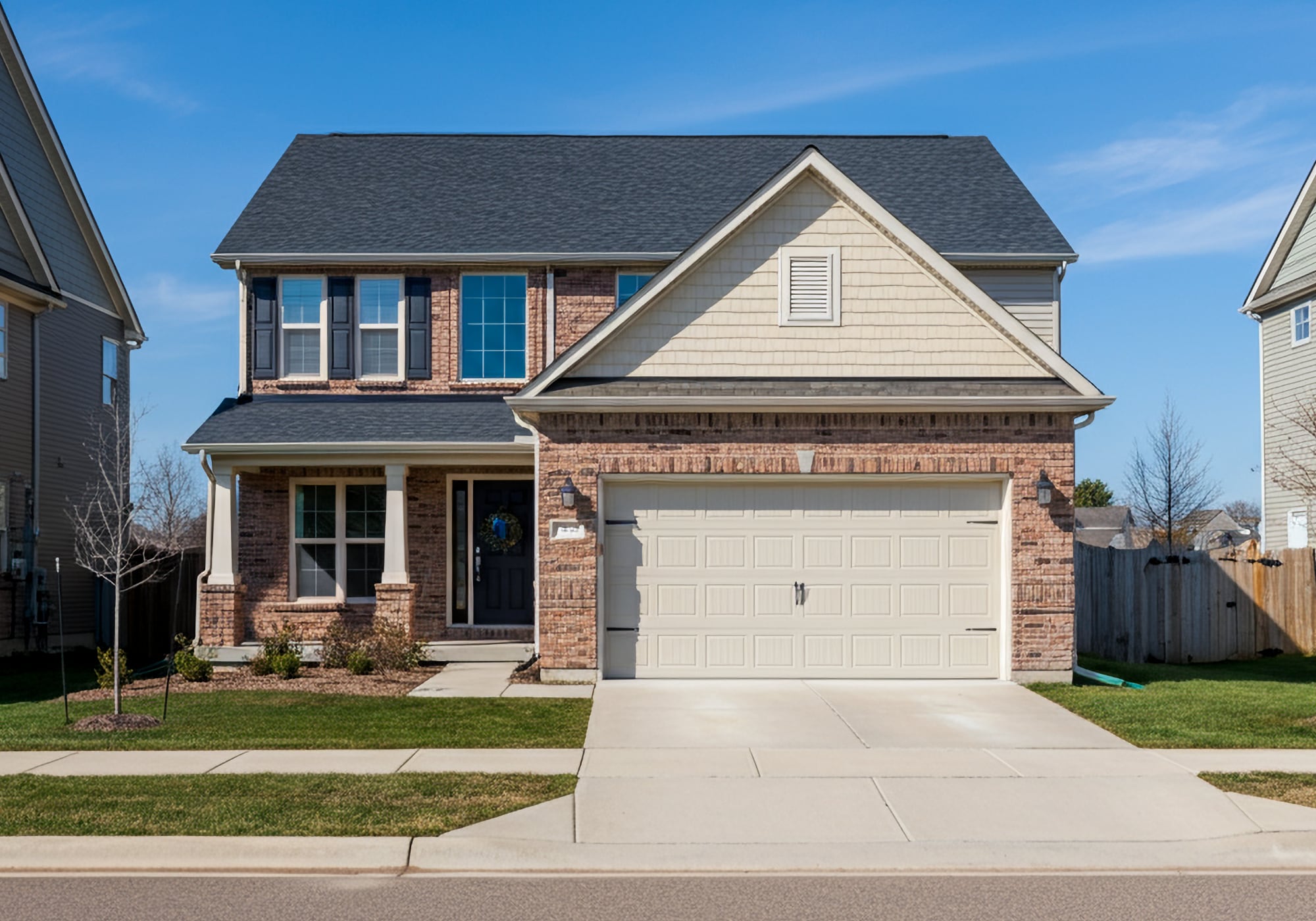 A 2000's brick two story home with attached two car garage in Northville Michigan