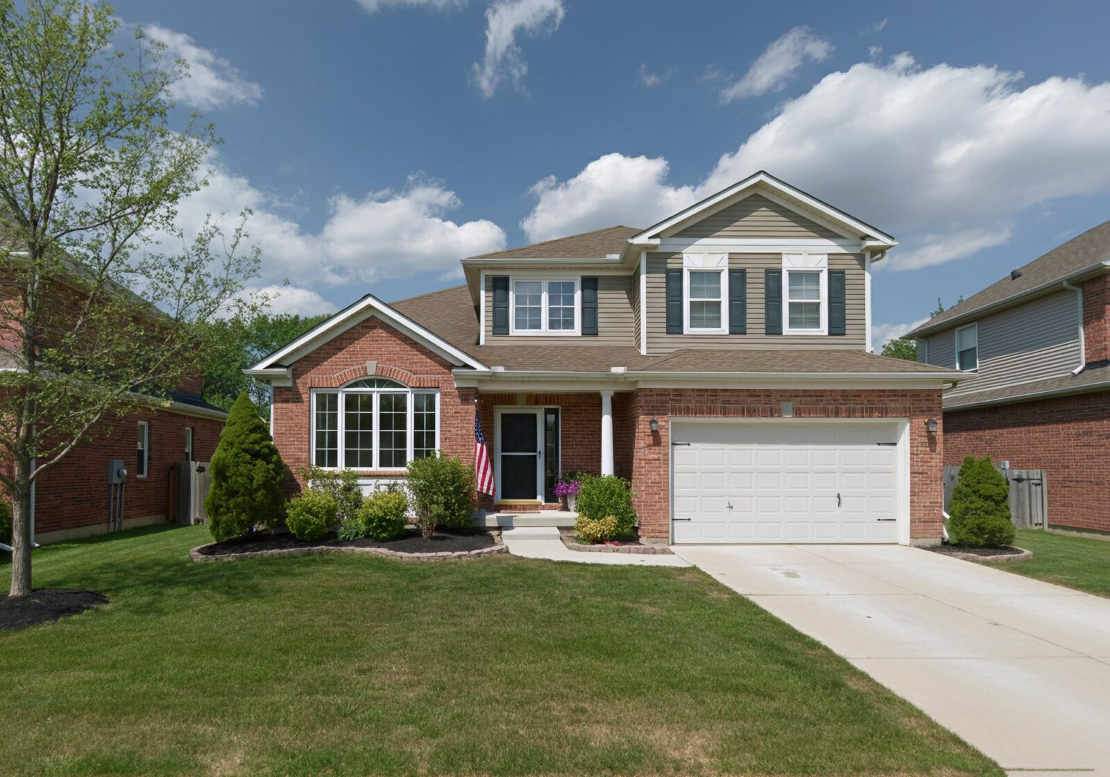 A 2010's brick two story home with two car attached garage in South Lyon Michigan